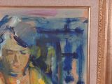 a painting of a woman reading a book in a gold frame
