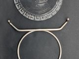 a glass plate and a metal stand on a table