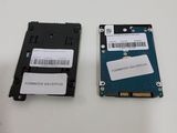 two hard drives are sitting next to each other on a table