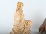 two statues that are sitting next to each other
