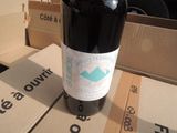 a bottle of wine that is sitting on a table