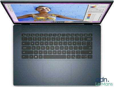 a laptop with a picture of a girl on the screen