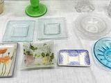 a table with a lot of glass dishes and vases on it