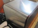 an image of a silver refrigerator in a room