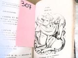 un livre ouvert sur lequel figure le dessin d'une femme