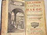 an old book with a picture of a group of people on it