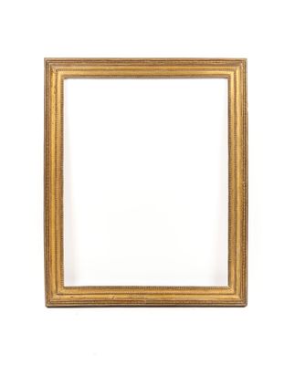 a gold frame on a white wall with a white background