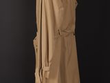 an image of a beige trench coat on a mannequin stand