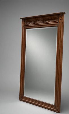 a large mirror with a wooden frame on a gray background