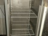 an image of an empty refrigerator in a kitchen