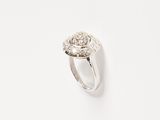 an image of a diamond and white gold ring on a white surface