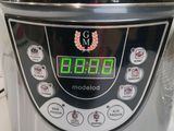 a close up of a digital rice cooker on a counter