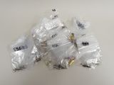 a pile of plastic bags with various types of screws