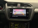 the interior of a car with a view of a car ' s rear view camera