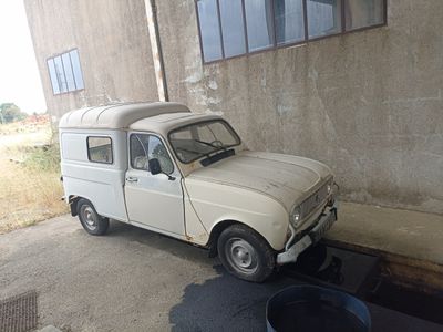 a small white truck parked in front of a building