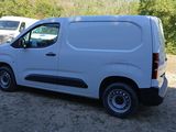 a white van that is parked on the side of the road