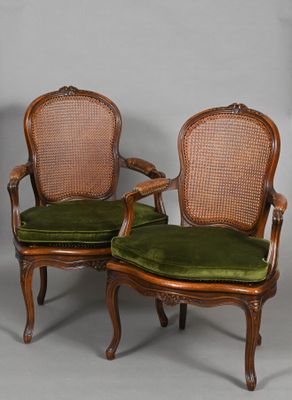 pair of antique cane back chairs with green velvet upholstered cushions