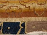 an old piece of cloth with a design on it