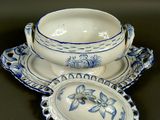 a blue and white bowl and saucer on a table