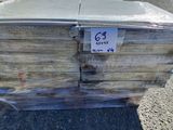 a stack of books sitting on the ground in a parking lot
