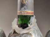 three bottles of wine that have been wrapped in plastic