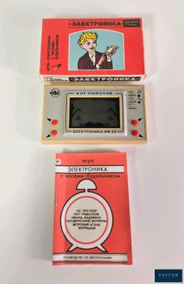 three electronic game consoles sitting next to each other