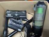 a box with a gun and a blow dryer inside of it