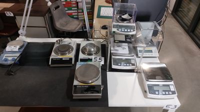 a table with a lot of electronic items on it