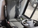 a seat in the driver ' s seat of a bus