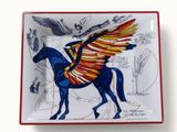 a plate with a drawing of a horse with wings on it
