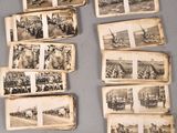 many old photos of people and animals on the table