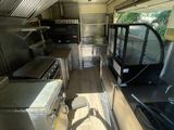 a view of a kitchen from the inside of a food truck