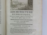 an open book with a picture of a city in the middle of it