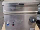 an image of a commercial gas fryer sitting on a pallet
