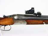the rifle is on display in the room with a white background