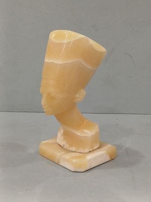 an image of a sculpture of a man ' s head on a marble base