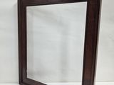 an image of a mirror with a wooden frame on a white background