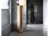 a lamp that is on a wooden pole in a room