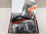 a box with a cell phone inside of it on a table
