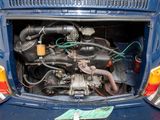 a small engine in the back of a blue car