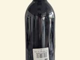 a bottle of wine that is sitting on a table