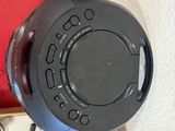 a black speaker that is sitting on the wall