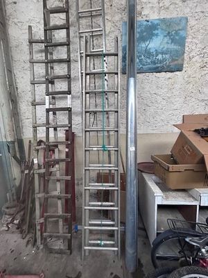 many different types of ladders in a garage