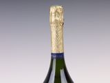 bottles of champagne are lined up on a white surface