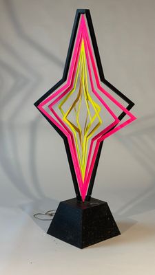 a close up of a sculpture of a star on a table