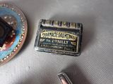 a picture of a pill case and a pill holder on a table