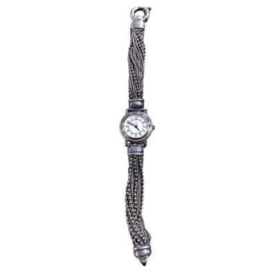 an image of a wrist watch with a chain around it