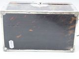 a metal box with a handle and a tag on it