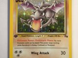 a close up of a pokemon card on a white surface