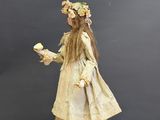 a doll that is standing on top of a box